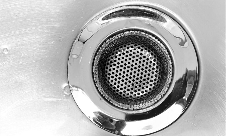 a close up of a metal sink drain